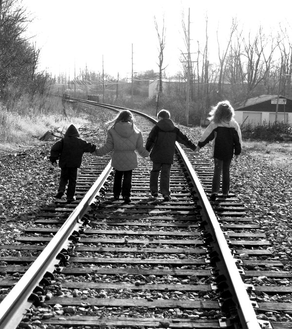 4_kids_on_rr_tracks_bnw_by_Gilpa