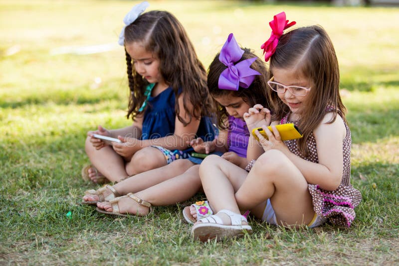little-girls-distracted-technology-cute-sisters-playing-their-ow