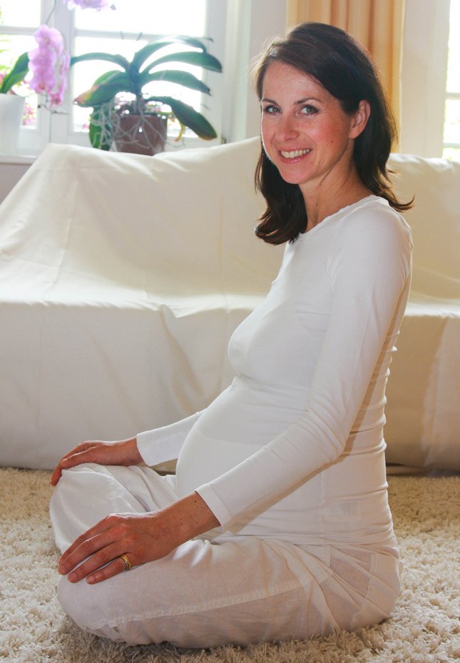 sexy pregnant mom in white smili